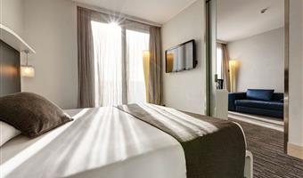 1 king size double bed, junior suite, 35sqm, living room, sofa, terrace, city view, wi-fi, bathrobe and slippers, coffee and tea maker, 1 bottle of water, minibar (free soft drinks), free room service, shopping card