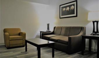suite-1 king bed, non-smoking, separate bedroom, 1 sofabed, two person whirlpool, flat screen television, microwave and refrigerator, full breakfast