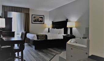 suite-1 king bed, non-smoking, separate bedroom, 1 sofabed, two person whirlpool, flat screen television, microwave and refrigerator, full breakfast