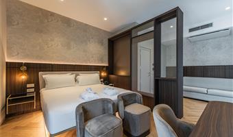 1 king bed, non-smoking, superior room, coffee and tea maker, bathrobe and slippers, wi-fi, 1 bottle of water, shopping card