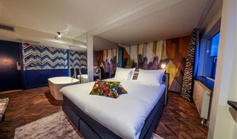 at hotel haarhuis.<br /><br />treat yourself a stay in our signature suite equipped with a comfortable design bed, luxurious freestanding bathtub and sofa.<br /><br />the signature suites are located at the rear of the hotel and equipped with all kinds of luxury facilities.<br /><br />unwind and escape into the luxurious freestanding bathtub with your favorite movie or tv show on the 49-inch tv screen in the background.<br /><br />