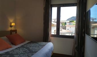 suite-1 queen bed, sofabed for two, lounge area, two televisions