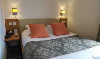 suite-1 queen bed, sofabed for two, lounge area, two televisions