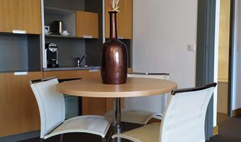 suite-1 queen bed, sofabed for two, lounge area, two televisions