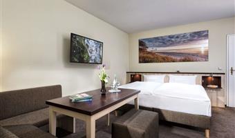 1 double bed, junior suite, separate building, partly with separate living room, bathrobe and slippers, cozy sitting corner, free parking, full breakfast