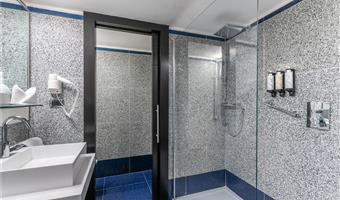 1 king bed, junior suite, 40 square meters, room on two levels, living area, wi-fi, coffee and tea maker, free room service, 1 bottle of water, bathrobe and slippers, shopping card