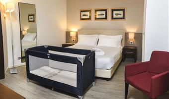suite-1 king bed, non-smoking room, double sofabed, living area, 2 32 inch led tvs, kitchenette, patio