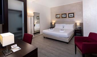 suite-1 king bed, non-smoking room, double sofabed, living area, 2 32 inch led tvs, kitchenette, patio