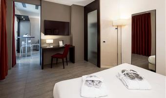 suite-1 king bed, non-smoking room, double sofabed, living area, 2 32 inch led tvs, kitchenette, patio