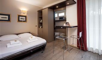 suite-1 king bed, non-smoking room, double sofabed, living area, 2 32 inch led tvs, kitchenette, patio