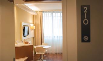 1 queen bed, comfort room, flat screen television, armchair, coffee maker, free garage