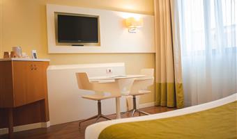 1 queen bed, comfort room, first floor, flat screen television, armchair, coffee maker