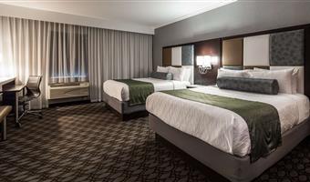 suite -2 letti queen size, camere non fumatori, divano letto per uno, 2 televisori a schermo piatto, scrivania, microonde e frigorifero, collegamento wi-fi